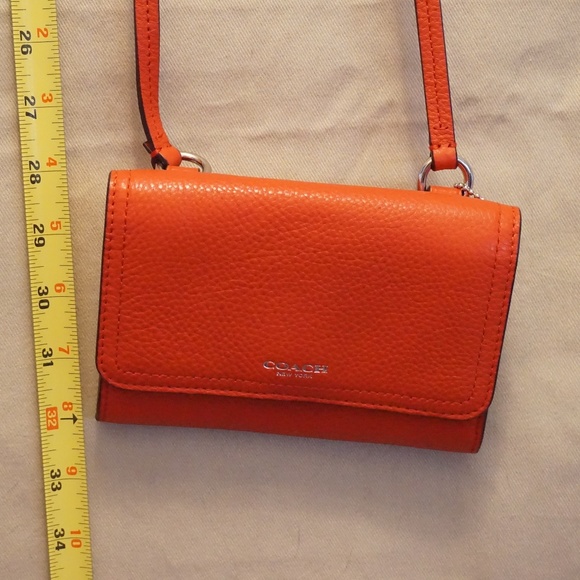 Coach Handbags - Coach Deep Coral Pebbled Leather Foldover Clutch